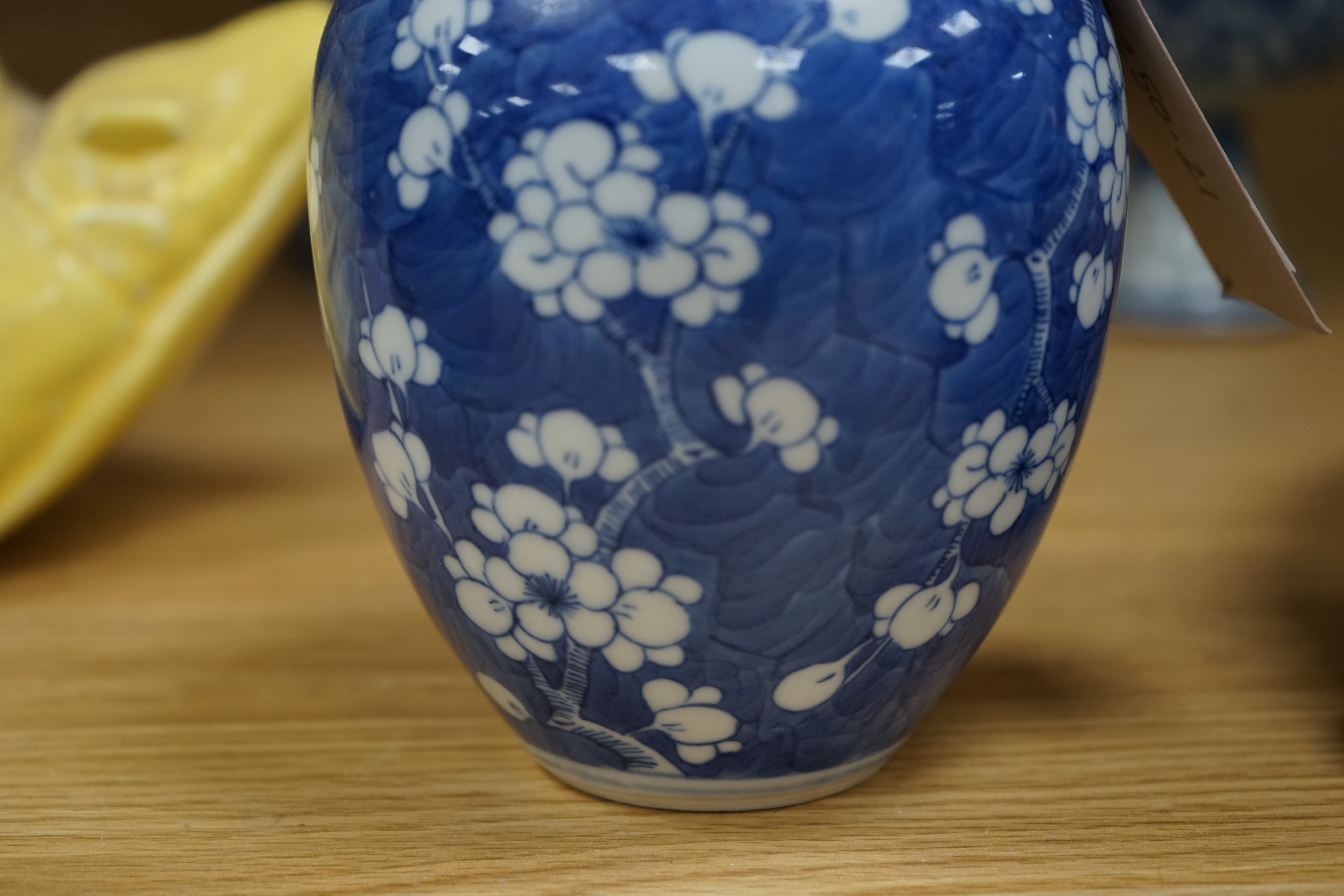 A Chinese blue and white ovoid jar and cover and similar stacking box, Kangxi and a Qing blue and white footed cup, tallest 15cm